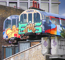 Tube trains covered in graffiti