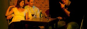 Rachel (Natalie Lessing) and Neal (Joseph Wilkins) look on as Richie (Dan Coffey) powders his nose