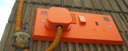 Orange over-sized plug in Carnaby St by Matt From London