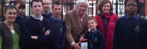 Conservation Foundation Executive Director, David Shreeve, hands over the elm