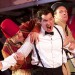17924_0630_comedyoferrors Josh Cohen (Dromio), Daniel Llewelyn-Williams (Antipholus) and Christopher Logan (Officer) get farcical in The Comedy of Errors at Regent's Park Open Air Theatre. Photo by Manuel Harlen