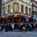 People smoking outside the John Snow Pub