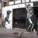 Phlegm's new piece (right) beside an old work by Roa.
