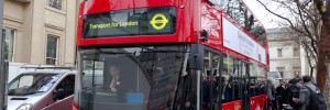 The bus arrives, with Transport for London commissioner Peter Hendy at the wheel