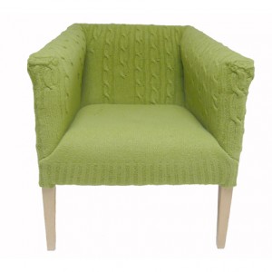 Maud is a modern version of the classic tub chair with natural wood legs. Covered in a graduated cable knit pattern. £1,500