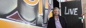 John Cierach stands beside the container.