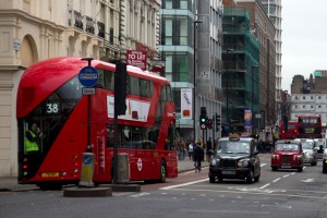 The bus moves off down New Oxford Street