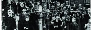 This photo shows the actress Julie Wilson (Kiss Me Kate, South Pacific) with young children from Bedfordbury estate in Covent Garden, 1951