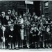 This photo shows the actress Julie Wilson (Kiss Me Kate, South Pacific) with young children from Bedfordbury estate in Covent Garden, 1951