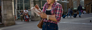 Hip reader, hip shooter outside Liverpool Street Station by Gary Kinsman
