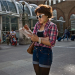 Hip reader, hip shooter outside Liverpool Street Station by Gary Kinsman