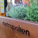 The Metropollen planter and seat, with bee hive and bat box in the background