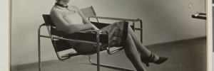 Erich Consemüller, Lis Beyer or Ise Gropius sitting on the B3 club chair by Marcel Breuer and wearing a mask by Oskar Schlemmer and dress fabric by Lis Beyer, c. 1927
