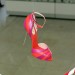 Louboutins hang in hoops in the stairwell of the Design Museum