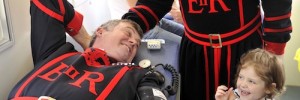 Blood transfusion beneficiary, Hannah Farrands, with Yeoman Warder Robin Fuller as he donates blood at the Tower of London.