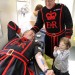 Blood transfusion beneficiary, Hannah Farrands, with Yeoman Warder Robin Fuller as he donates blood at the Tower of London.