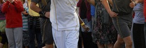 Paul Stanley McKenzie carries the Torch through Walthamstow - watch out for it around London this week / photo by peterphotographic