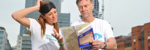 Natalie Pinkham and Sir Ranulph Fiennes check an A-Z