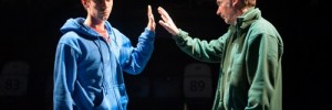 Luke Treadaway as Christopher Boone and Paul Ritter as Ed