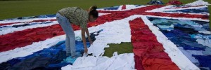 Marks & Spencers creates World's largest Union Jack flag from unwanted clothes as part of its Shwopping initiative. 2,100 unwanted clothes were uses to create giant clothes mosaic in East London today.  Using 2,100 unwanted clothes items of clothes donated to the Shwopping initiative, Marks & Spencers, local volunteers and charity partner Oxfam joined forces to make the worls's ;largest Union Jack.  Flag was created in a race against the clock to finish bbefore the winner of the 10km Open water Swi n at the Serpentine crosses the finish line   - London, Brita