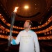 Actor Eddie Marsan holds the Paralympic Flame inside the Royal Opera House in London.