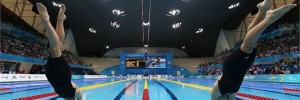 Jessica-Anne Applegate of Team GB and Kayla Clarke of Australia dive in. Image from London2012.