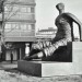draped seated woman