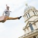 Max Calaf performs on a trampoline in the Old Royal Naval College at the festival launch