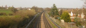 12213_CentralLinetracks We cross the Central Line tracks north of Buckhurst Hill. The arrival of the Tube in these parts led to the rapid growth of many small hamlets, but the area retains an air of the countryside.