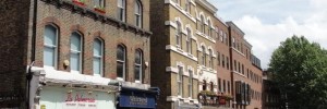 18168_GBB_Hampstead Hampstead High Street: "And the shops were busy, doors open, inviting, whilst the mortals inside them paid homage to their other great object of worship - money. No wonder Hermes was always working." p.68