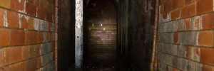 The narrow, raised walkway joining the two branches of the Fleet Sewer.