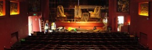 Builders finish off the new stage in the auditorium. The 1910 ceiling has been painted the colour it originally was.